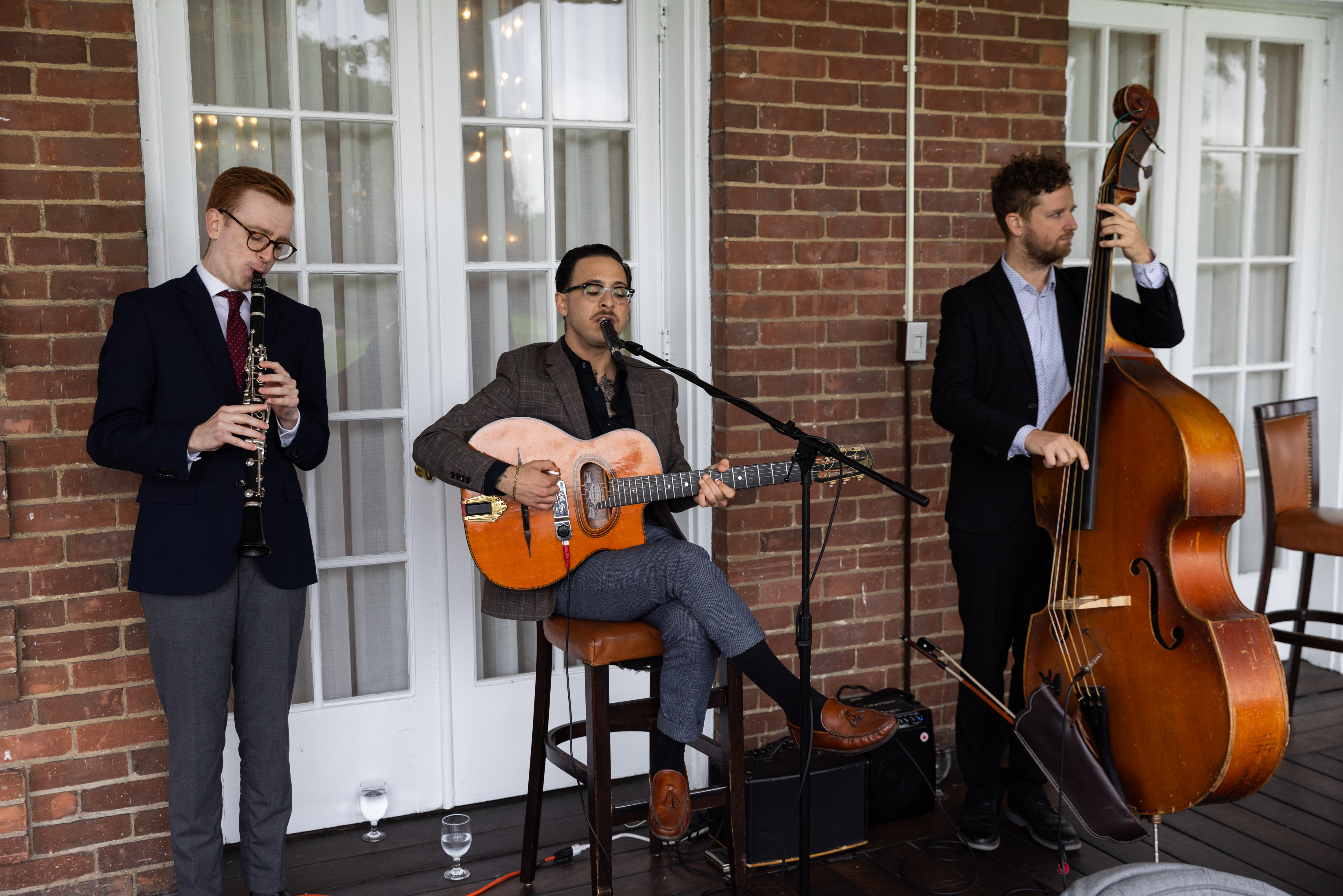 3 gentlemen playing musical instruments 