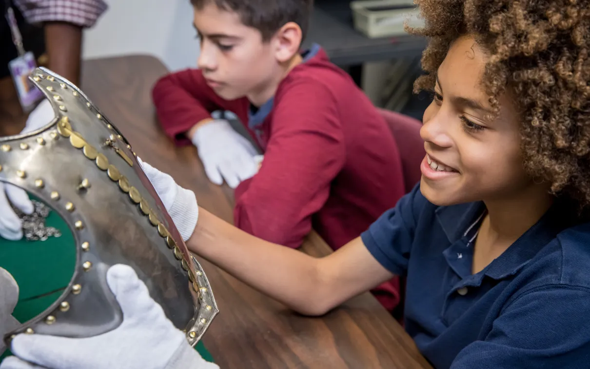 Student looking at armour